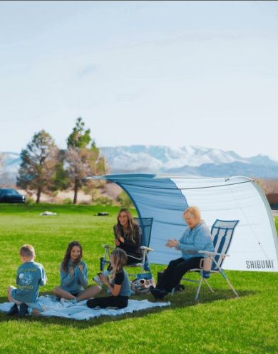 Shibumi Shade Classic wind-powered beach shade canopy billowing in the breeze