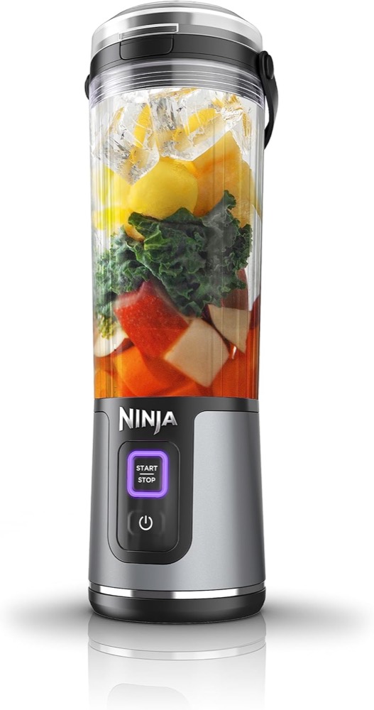 Ninja Blast 18 oz cordless portable blender in black, filled with fruit and ice, showing the START/STOP button base