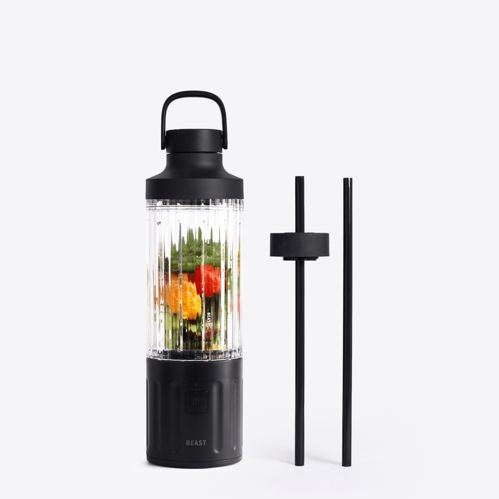 Beast GO Cordless portable blender in carbon black with a ribbed clear vessel of blended smoothie, shown beside its straw cap and two black straws
