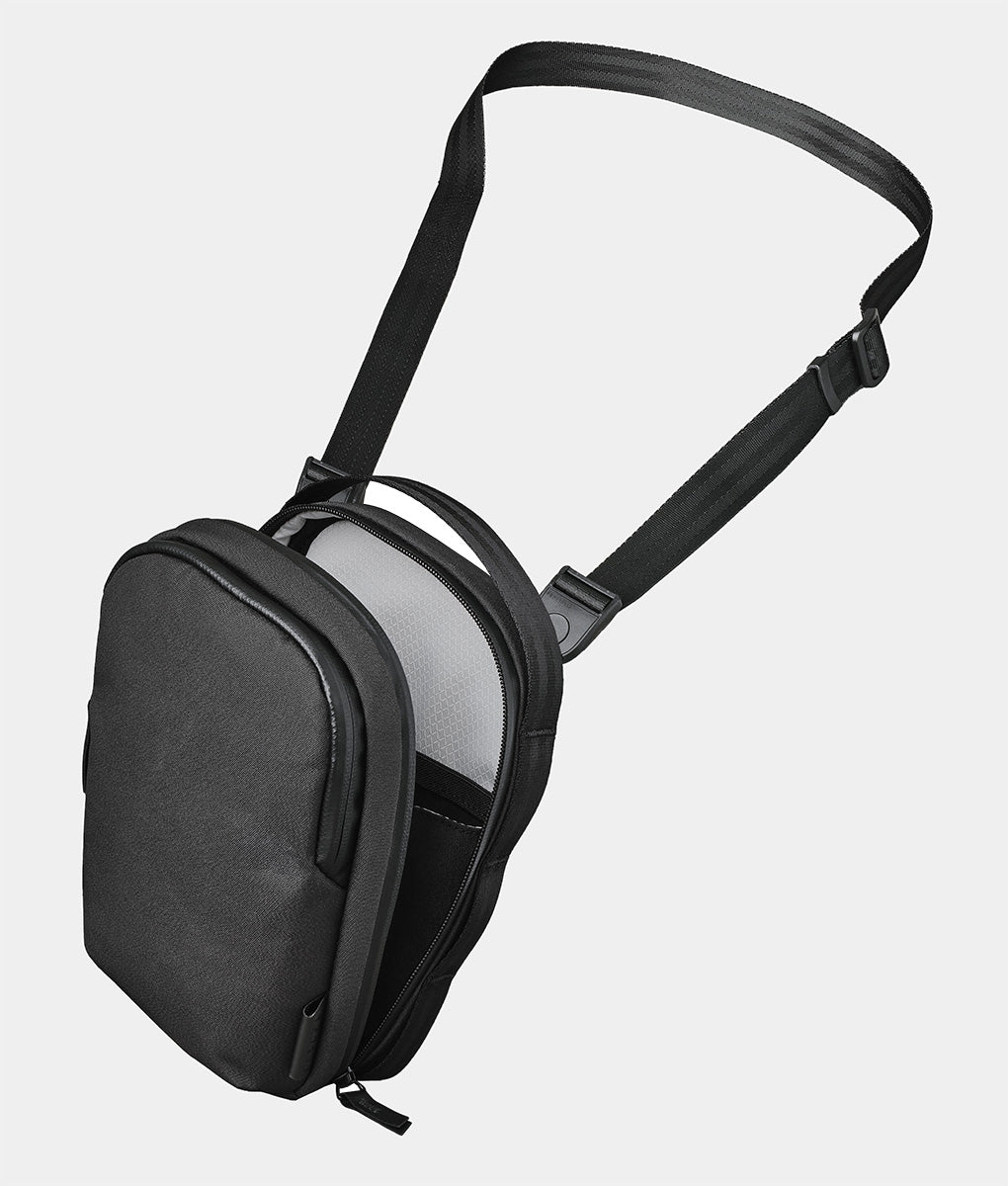 ALPAKA Metro Sling V2 compact black crossbody sling bag with upright shape, top handle, and adjustable shoulder strap