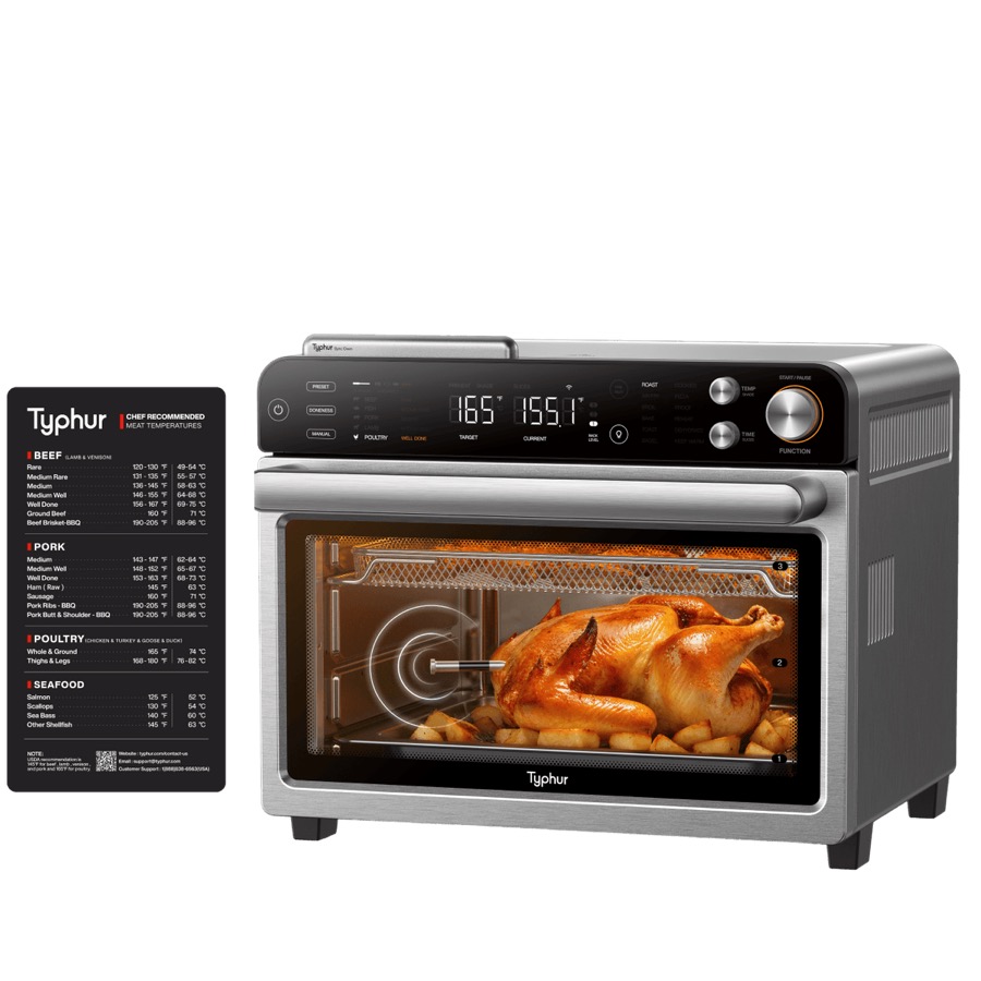Typhur Dome 2 stainless steel air fryer with a whole roast chicken visible through the glass door beside a meat-temperature guide card